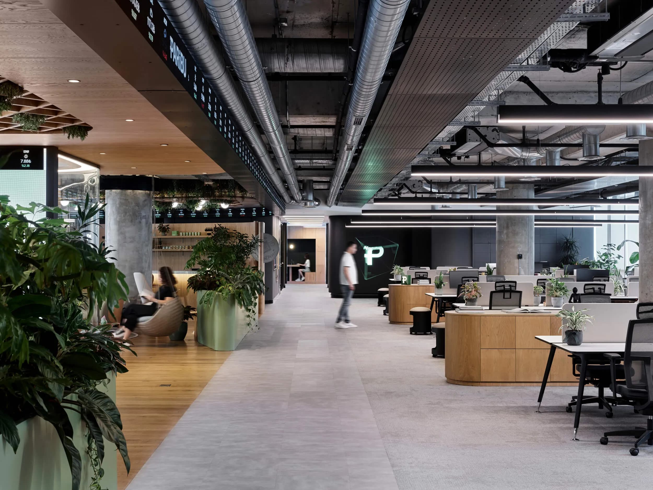 Modern office space with wooden furniture and plants